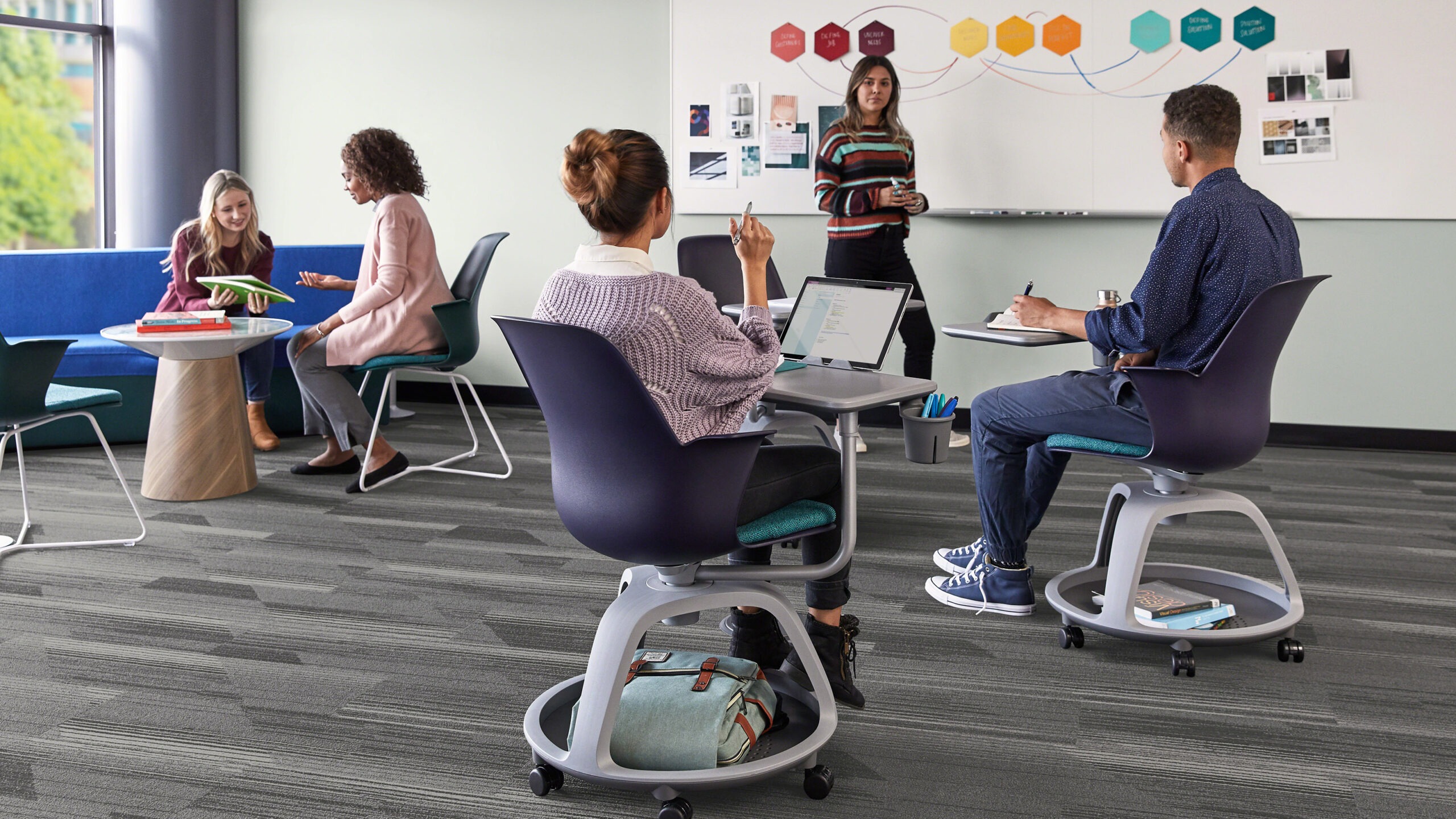 Students using the Steelcase Node chair in classrooms