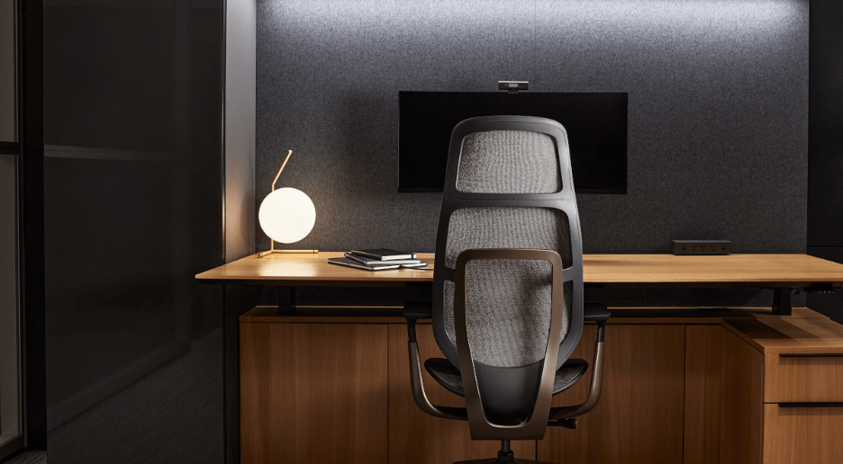 Grey colored Steelcase Karman chair in a minimalist office setup.