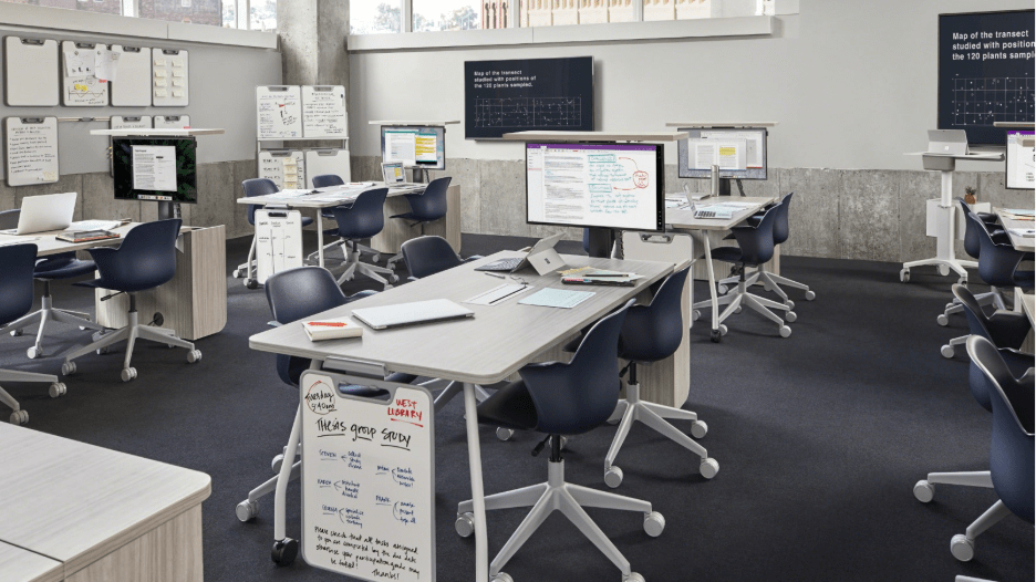 White colored Steelcase Verb Active Media Table in a team-based learning environment office setup.
