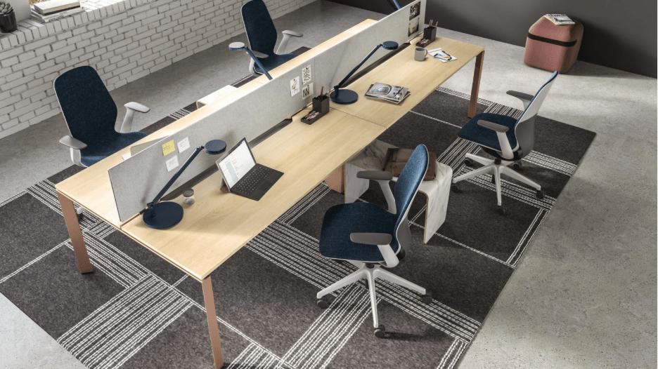 Steelcase FrameOne table with a light wood finish in a team-based learning environment office setup. 
