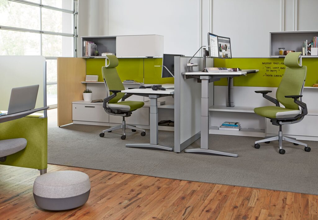 Steelcase Ology height adjustable desk in modern office.